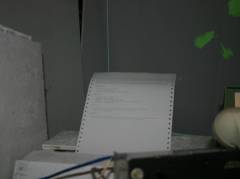 The dot-matrix printer used for printing briefing and debriefing reports.